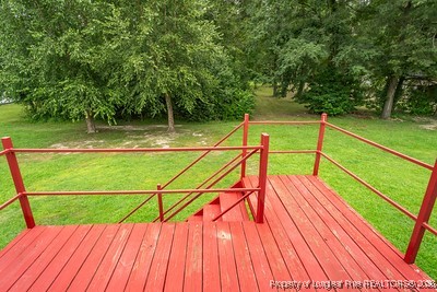 1012 Asbury Road Eastover, NC 28312 - Photo 37 of 38 a view of wooden deck with a lake view
