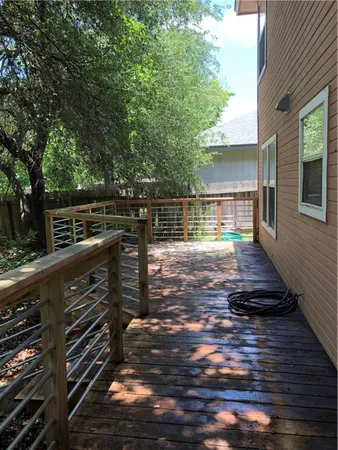 a view of a balcony with wooden floor