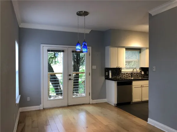 a kitchen with granite countertop a stove and a sink
