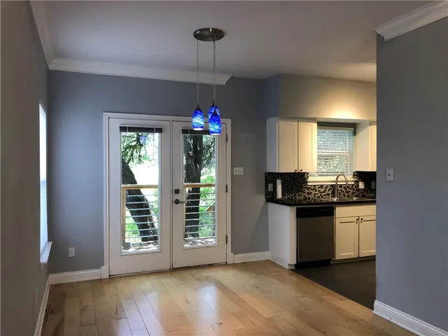 a kitchen with granite countertop a stove and a sink
