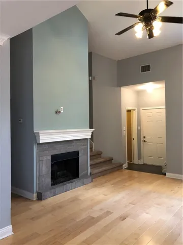 a view of an empty room with a fireplace