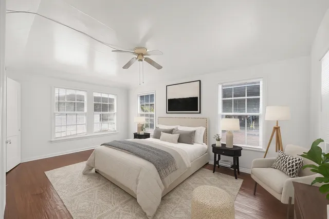 a bedroom with a bed and a couch