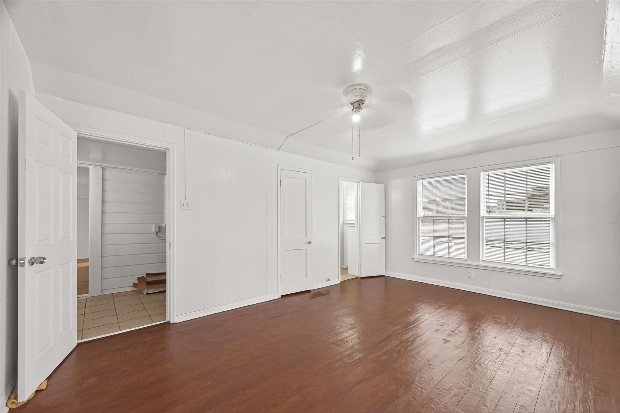 4212 Woodhead Street, Unit 2 Houston, TX 77098 - Photo 14 of 26 wooden floor in an empty room with a window