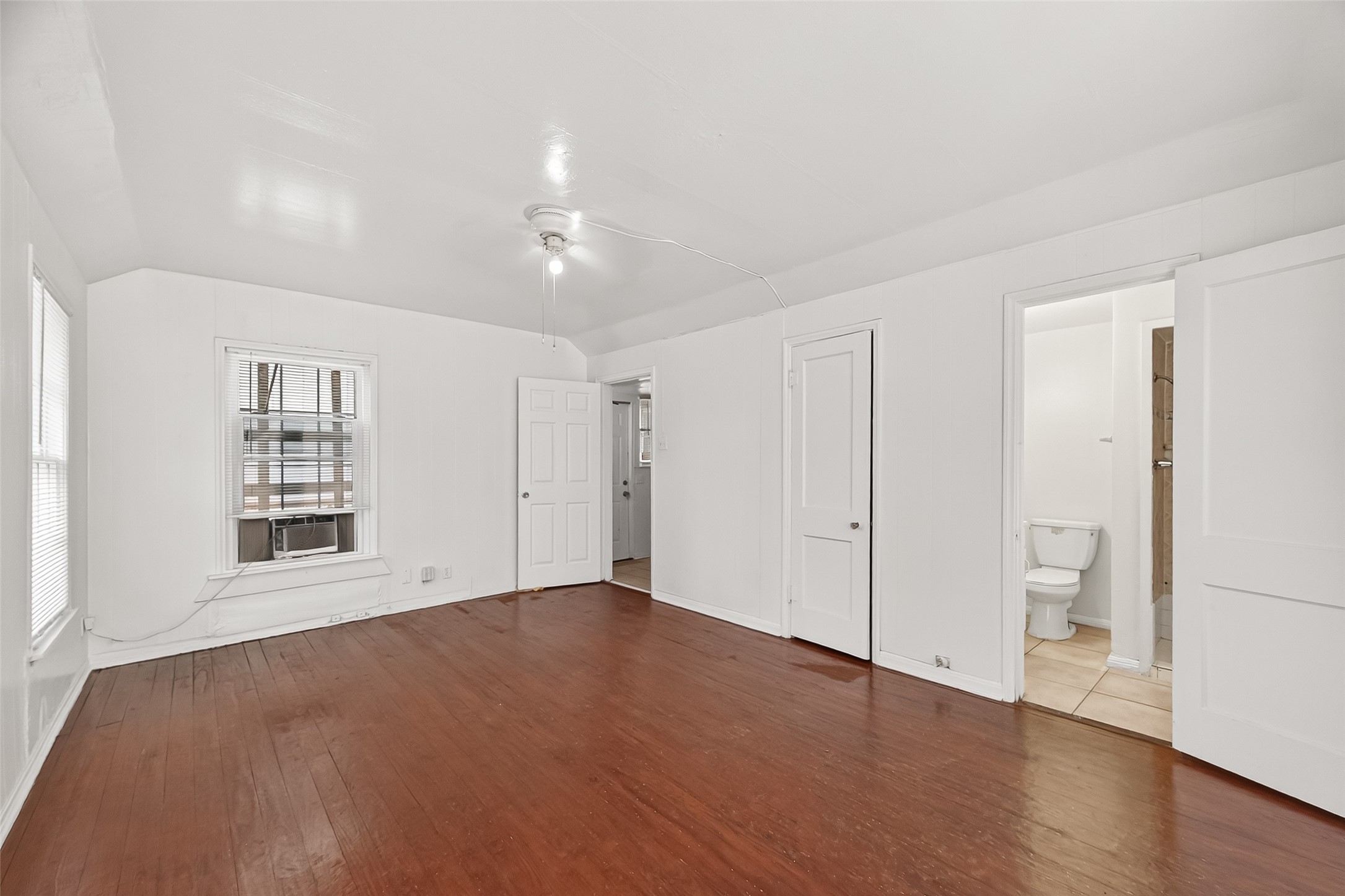 4212 Woodhead Street, Unit 2 Houston, TX 77098 - Photo 15 of 26 an empty room with a bathroom and a toilet