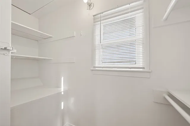 a view of a room that has a window in it