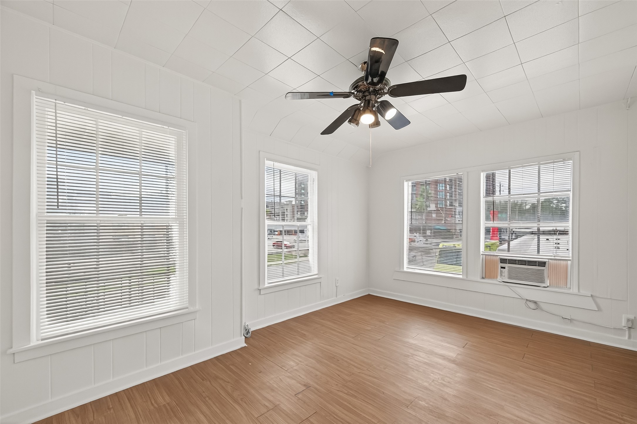 4212 Woodhead Street, Unit 2 Houston, TX 77098 - Photo 21 of 26 a view of empty room with wooden floor and fan