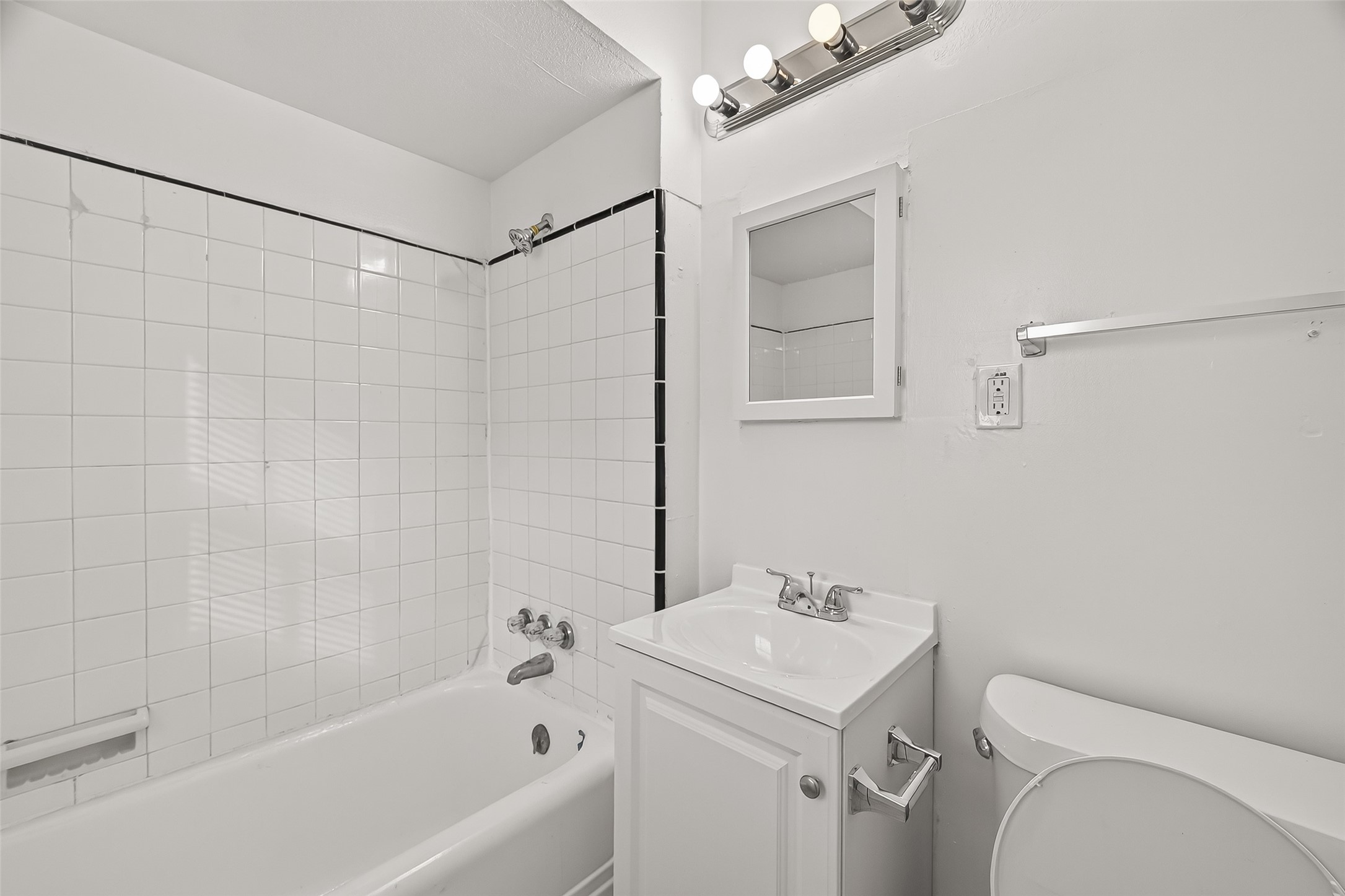 4212 Woodhead Street, Unit 2 Houston, TX 77098 - Photo 24 of 26 a bathroom with a sink a toilet and shower