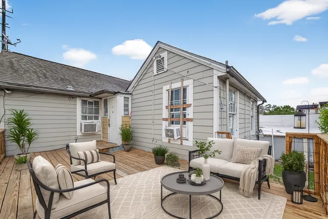 a view of a patio with couches and potted plants