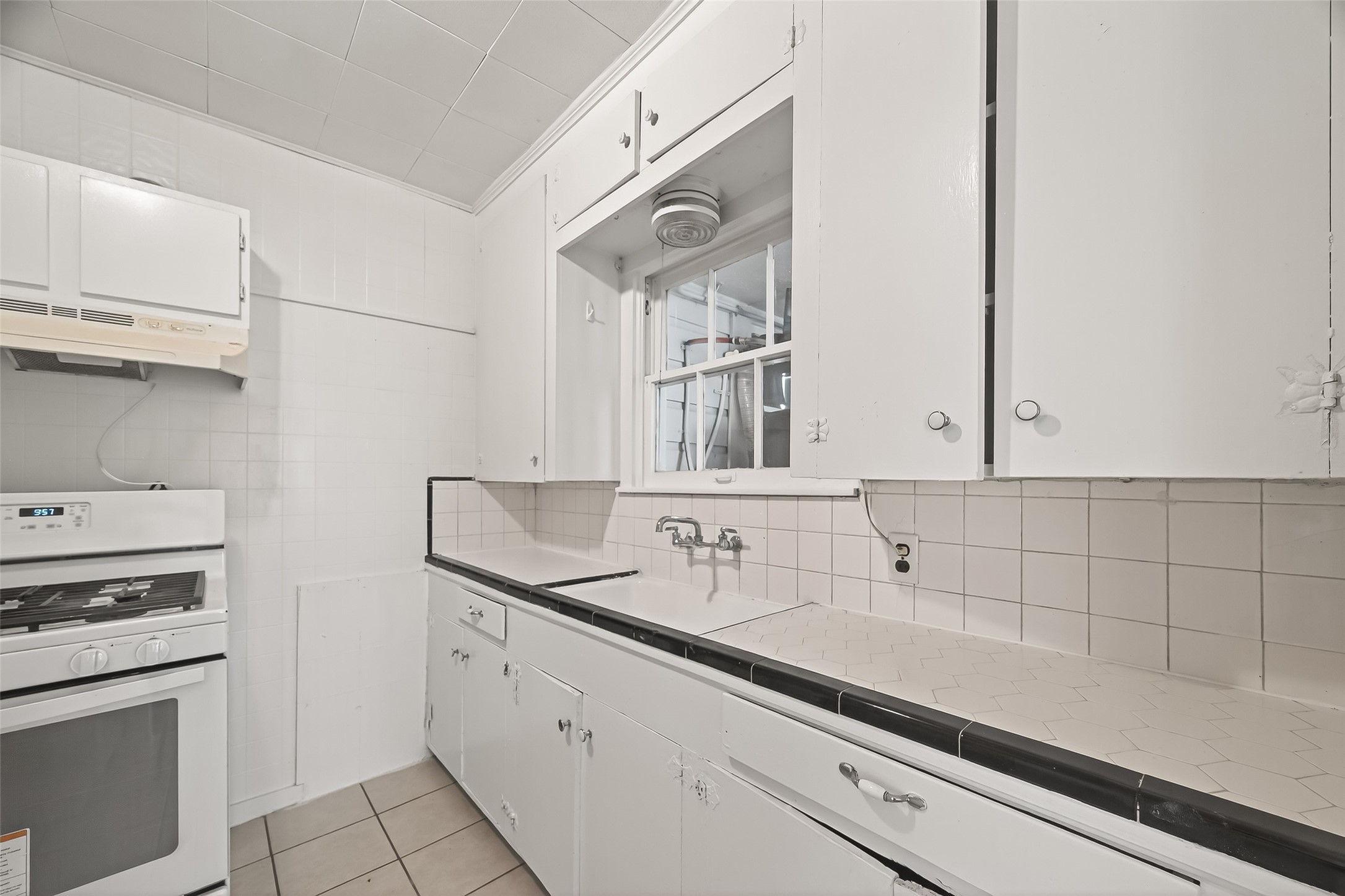 4212 Woodhead Street, Unit 2 Houston, TX 77098 - Photo 9 of 26 a kitchen with appliances cabinets and a sink
