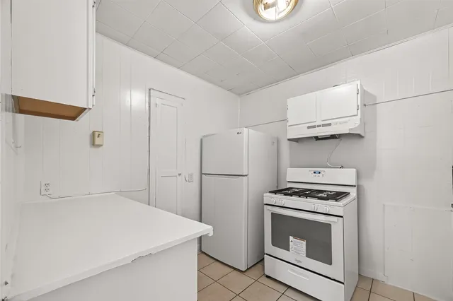 a kitchen with a stove a washer and dryer
