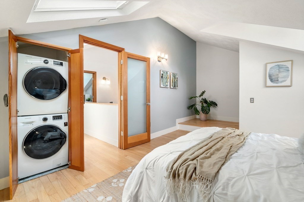 145 Federal Street, Unit 3 Salem, MA 01970 - Photo 11 of 21 a bedroom with a bed a washer and dryer