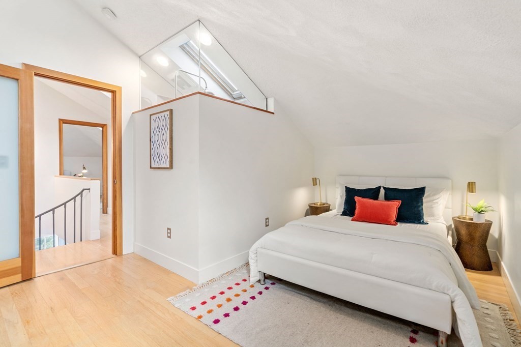 145 Federal Street, Unit 3 Salem, MA 01970 - Photo 12 of 21 a bedroom with a bed and a chandelier