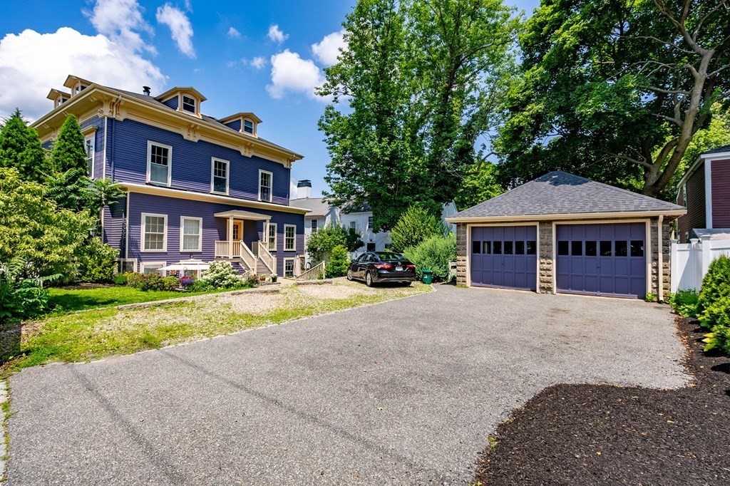 145 Federal Street, Unit 3 Salem, MA 01970 - Photo 16 of 21 a front view of a house with a yard and garage