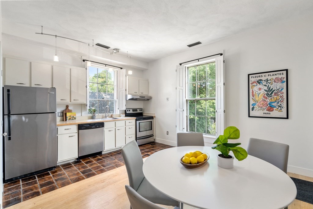145 Federal Street, Unit 3 Salem, MA 01970 - Photo 5 of 21 a kitchen with stainless steel appliances furniture and a window