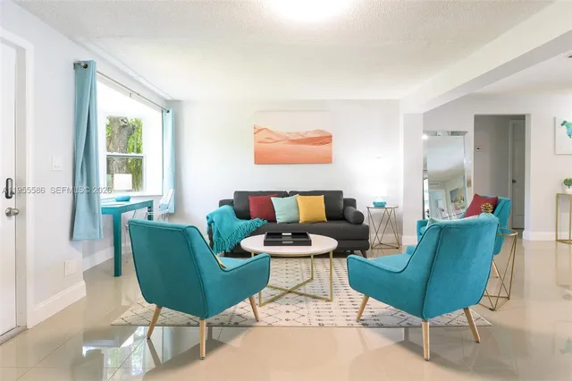 a living room with furniture and a window