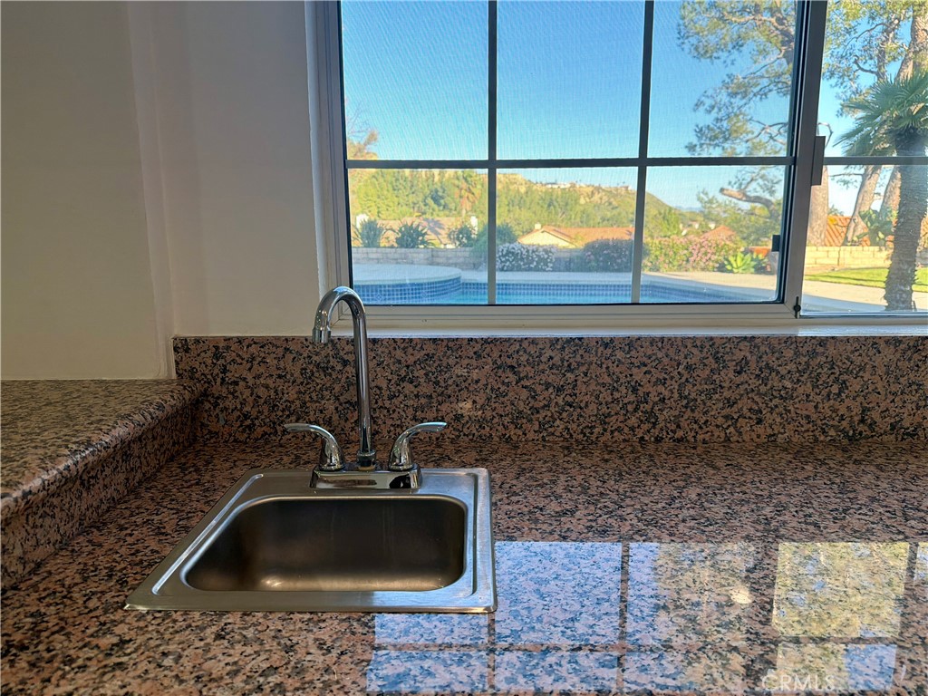 11932 Sonoma Way Porter Ranch, CA 91326 - Photo 14 of 63 a bathroom with a sink and a window