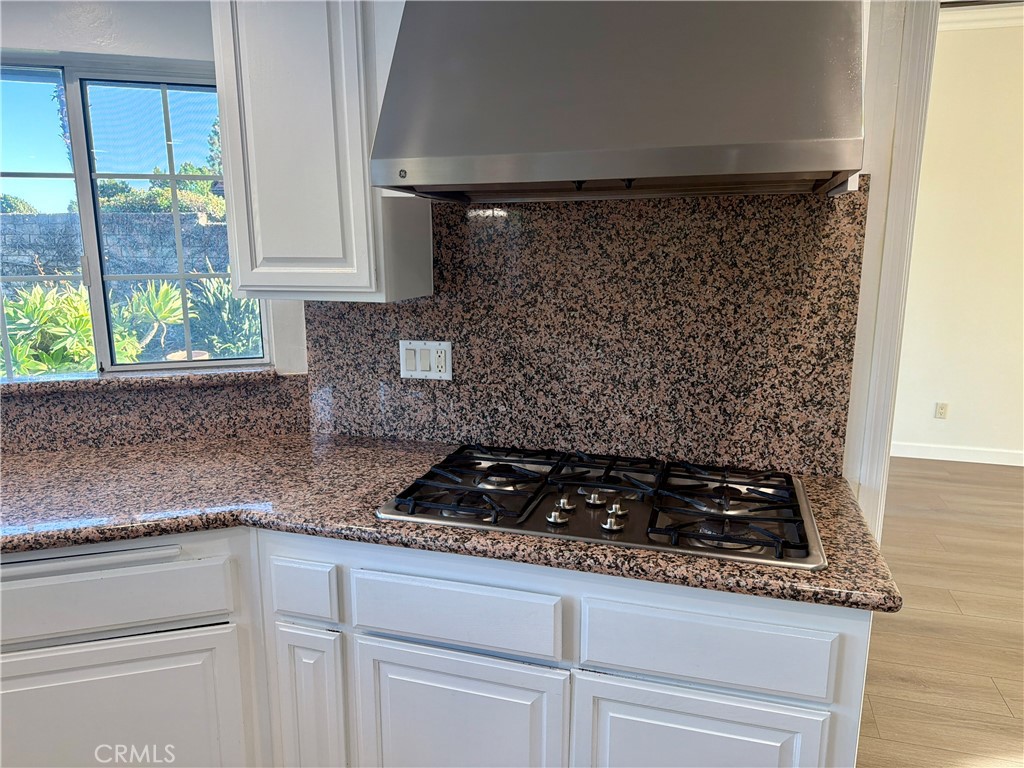 11932 Sonoma Way Porter Ranch, CA 91326 - Photo 16 of 63 a kitchen with a sink and cabinets
