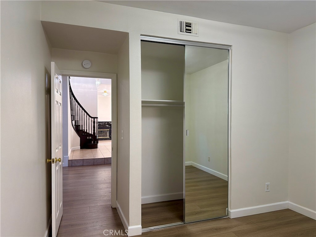 11932 Sonoma Way Porter Ranch, CA 91326 - Photo 22 of 63 a view of a hallway with wooden floor and entryway