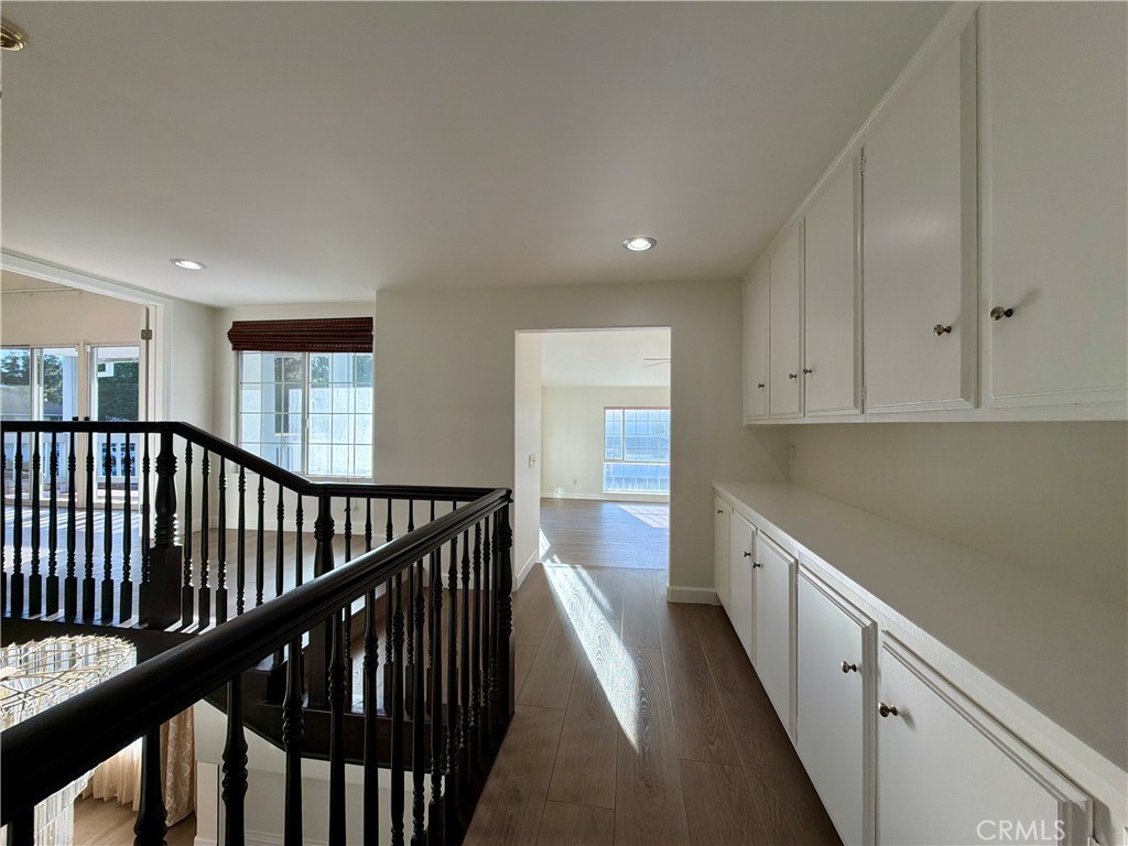 11932 Sonoma Way Porter Ranch, CA 91326 - Photo 25 of 63 a view of a hallway with wooden floor and staircase