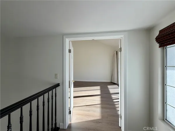 a spacious bathroom with a granite countertop sink and a mirror