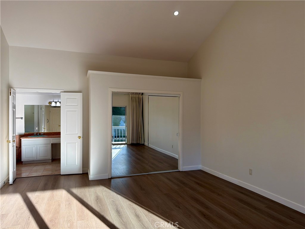 11932 Sonoma Way Porter Ranch, CA 91326 - Photo 32 of 63 a view of a hallway with wooden floor and closet