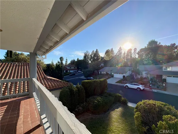 a spacious bathroom with a tub a sink and a mirror