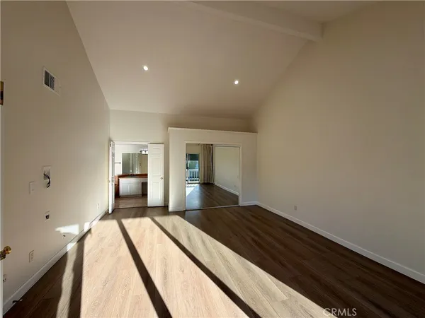 a bathroom with a granite countertop toilet and a shower