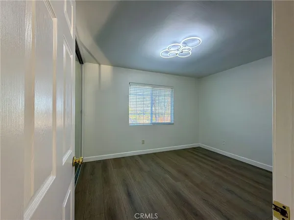 a view of hallway with wooden floor
