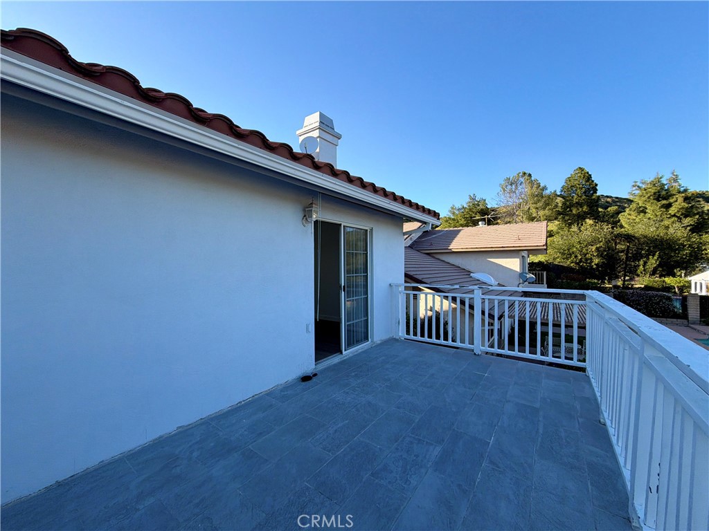 11932 Sonoma Way Porter Ranch, CA 91326 - Photo 49 of 63 a view of a roof deck with wooden floor and fence