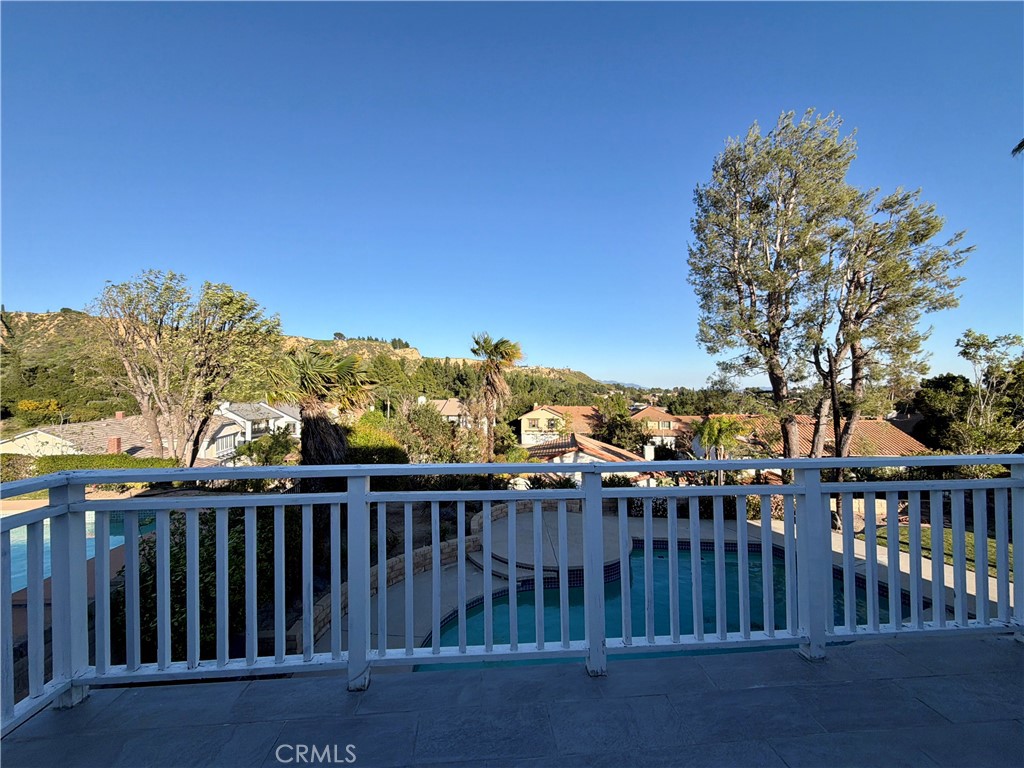 11932 Sonoma Way Porter Ranch, CA 91326 - Photo 50 of 63 a view of a roof deck with wooden fence and floor