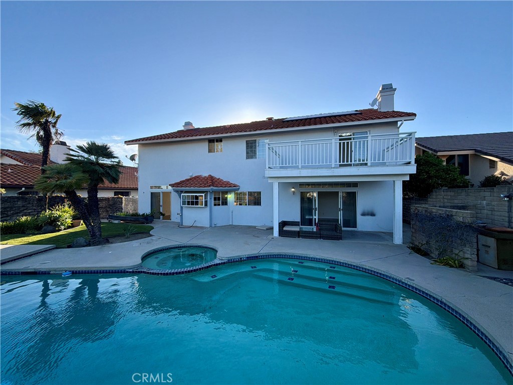 11932 Sonoma Way Porter Ranch, CA 91326 - Photo 57 of 63 a front view of a house with a yard table and chairs