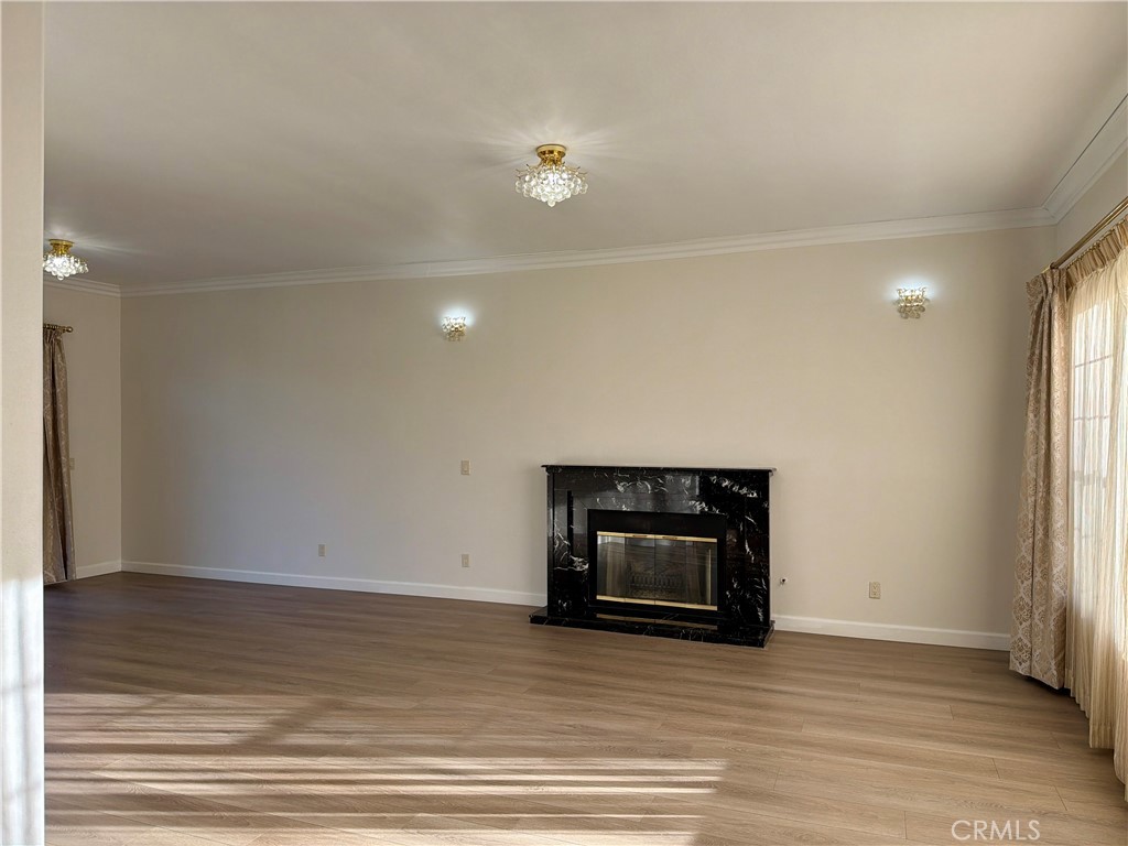 11932 Sonoma Way Porter Ranch, CA 91326 - Photo 7 of 63 a view of a livingroom with wooden floor and a fireplace