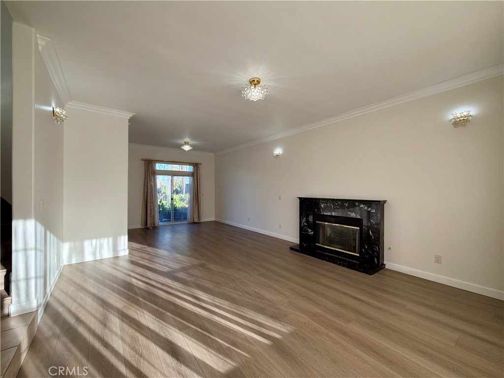 11932 Sonoma Way Porter Ranch, CA 91326 - Photo 8 of 63 a view of empty room with wooden floor and fireplace