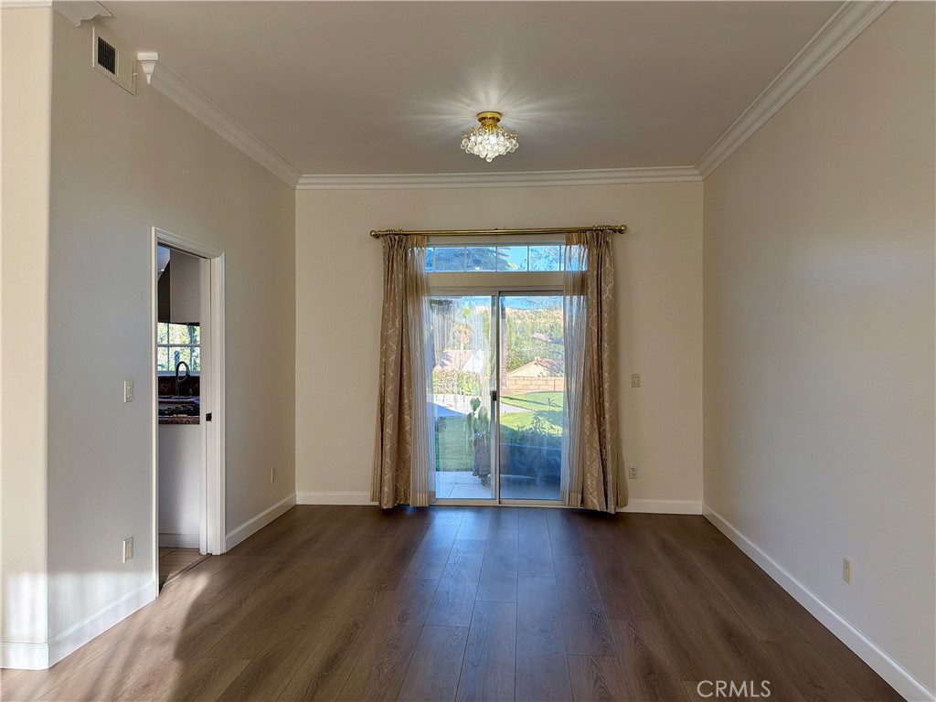 11932 Sonoma Way Porter Ranch, CA 91326 - Photo 9 of 63 an empty room with wooden floor and windows