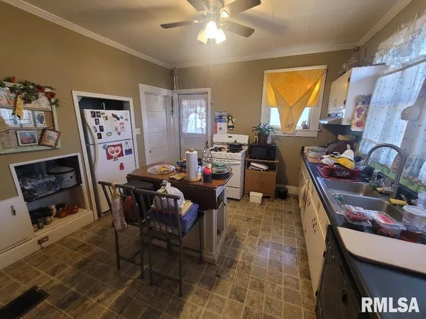 a view of a livingroom with furniture and a window
