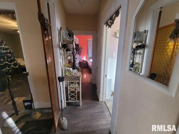 a view of a livingroom with furniture and staircase