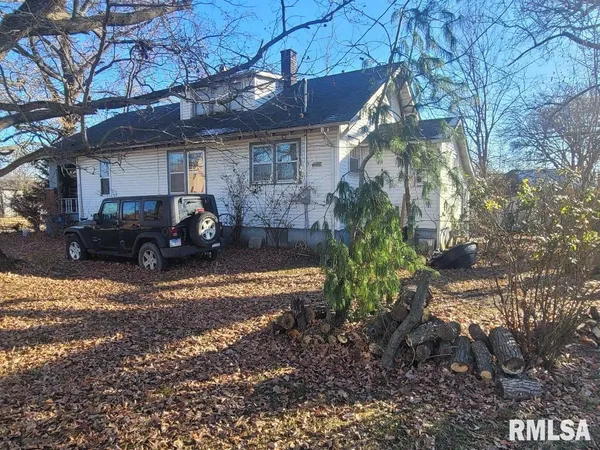 a view of a car parked in front of a house