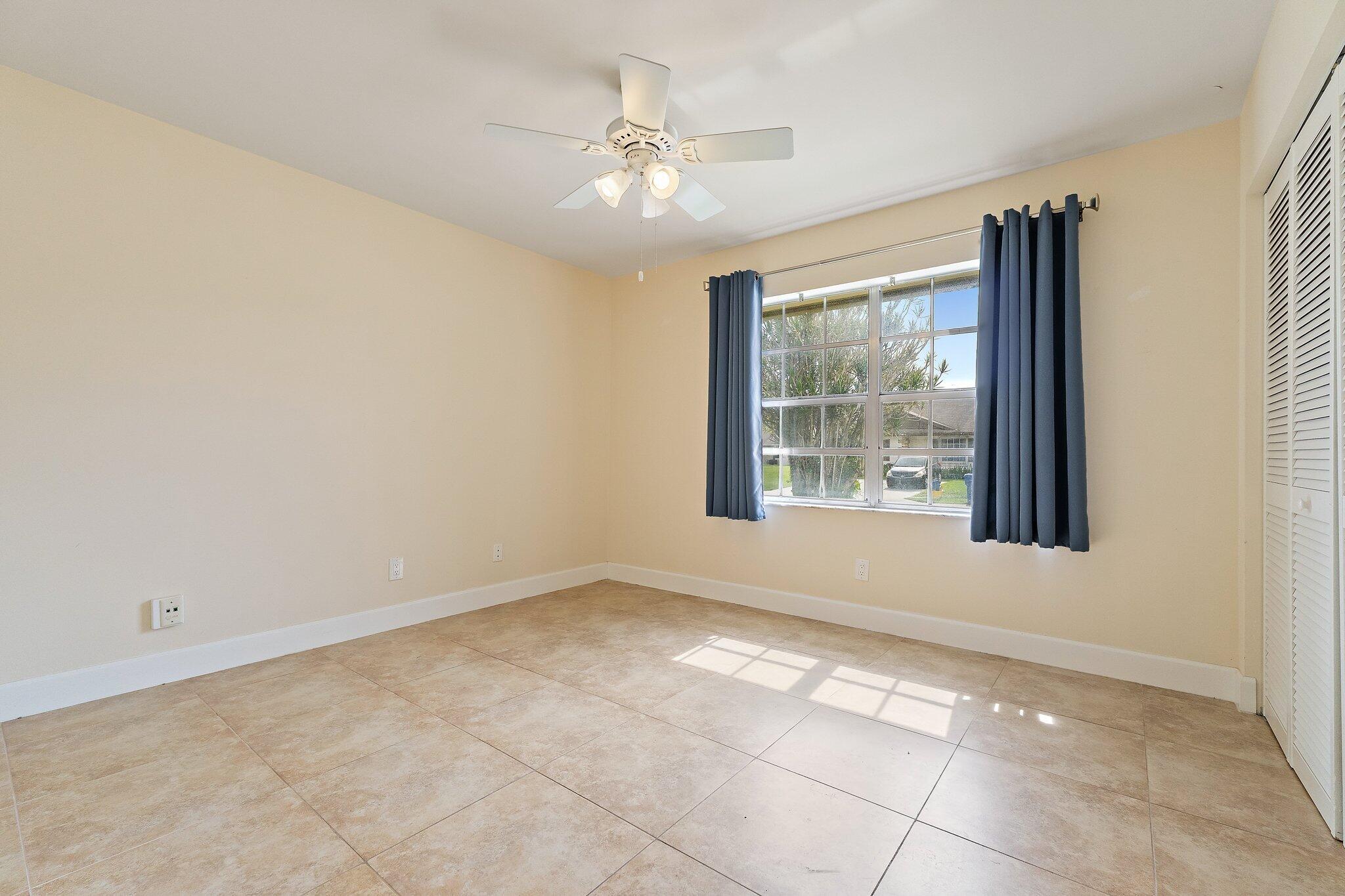 109 Doe Trail Jupiter, FL 33458 - Photo 17 of 26 a view of an empty room with a window