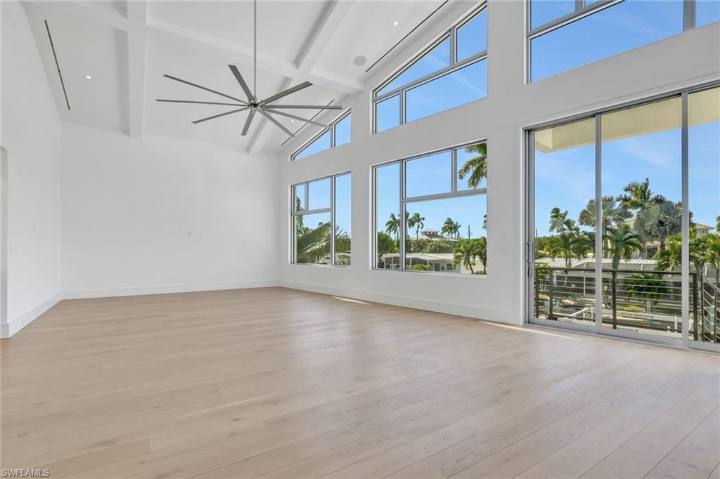 1798 Holiday Lane Naples, FL 34104 - Photo 12 of 31 a view of a room with wooden floor and window