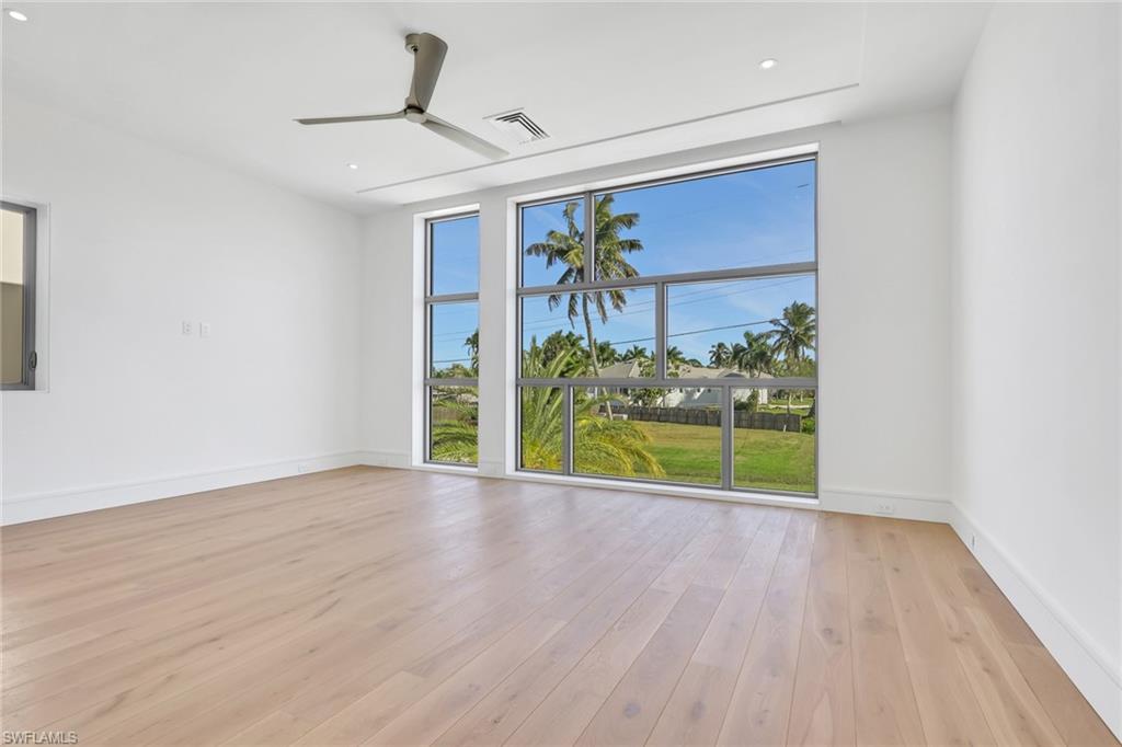 1798 Holiday Lane Naples, FL 34104 - Photo 14 of 31 a view of a room with wooden floor