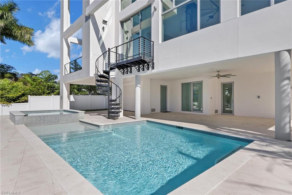 1798 Holiday Lane Naples, FL 34104 - Photo 23 of 31 front view of a house with a yard