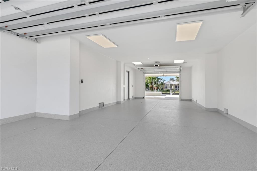 1798 Holiday Lane Naples, FL 34104 - Photo 24 of 31 a view of a big room with wooden floor and windows