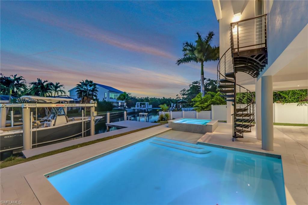 1798 Holiday Lane Naples, FL 34104 - Photo 27 of 31 a view of a balcony with chairs