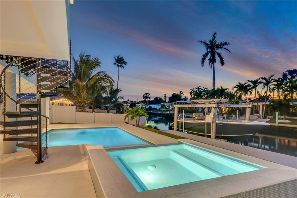 1798 Holiday Lane Naples, FL 34104 - Photo 28 of 31 a view of a swimming pool with seating area