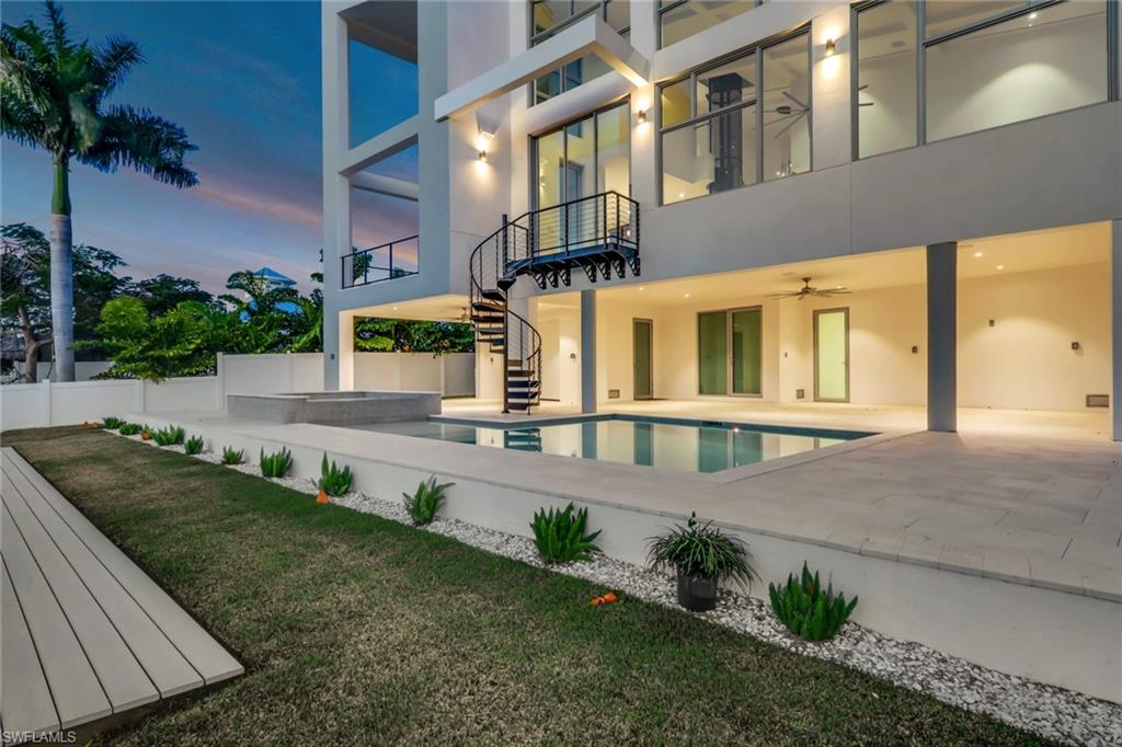1798 Holiday Lane Naples, FL 34104 - Photo 29 of 31 a house view with a garden space