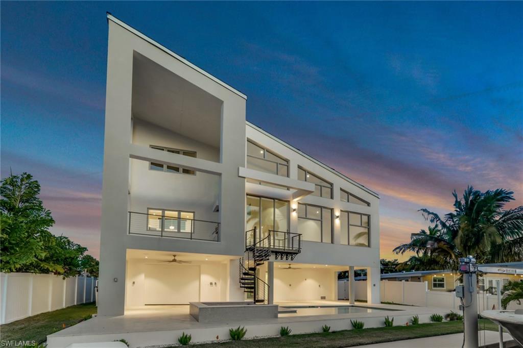 1798 Holiday Lane Naples, FL 34104 - Photo 30 of 31 a front view of a house with yard