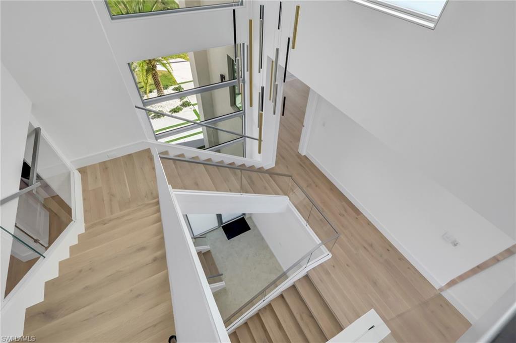 1798 Holiday Lane Naples, FL 34104 - Photo 3 of 31 a view of entryway and hall with wooden floor