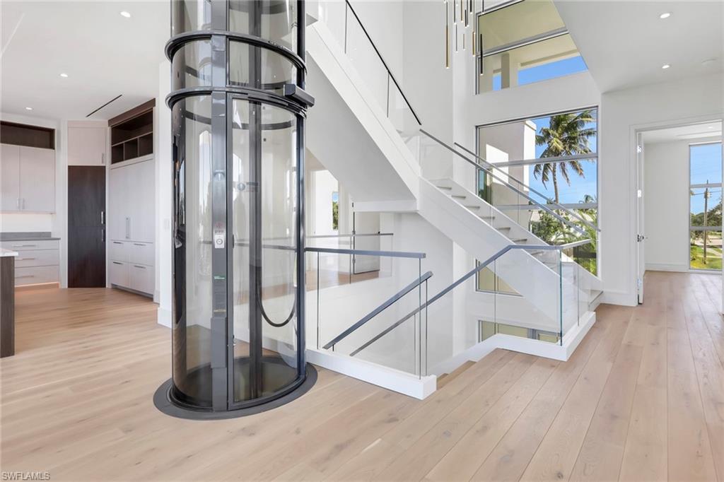 1798 Holiday Lane Naples, FL 34104 - Photo 4 of 31 a view of entryway and hall with wooden floor