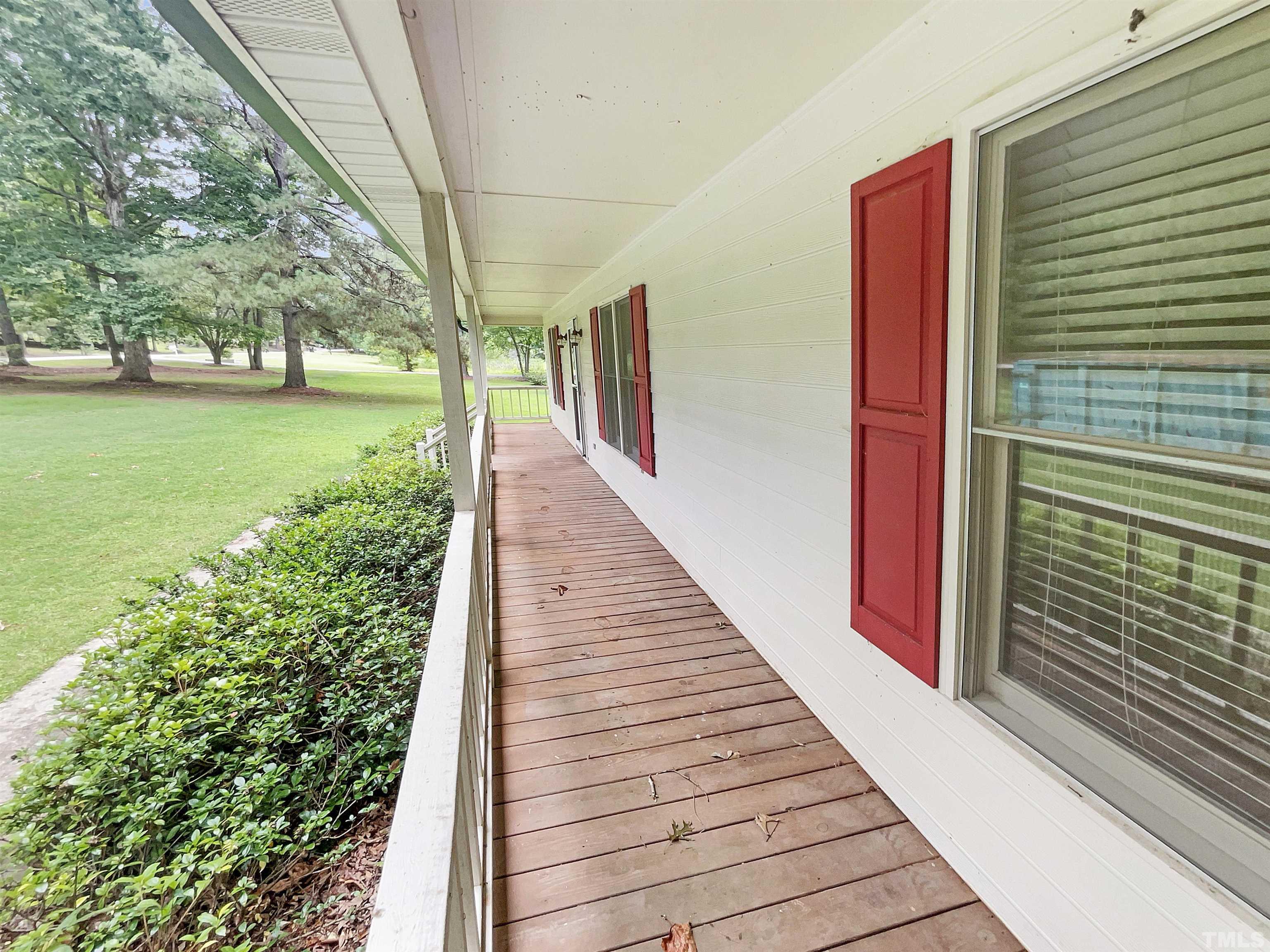2025 Canterbury Road Clayton, NC 27520 - Photo 18 of 18 a view of a pathway of a house with a yard
