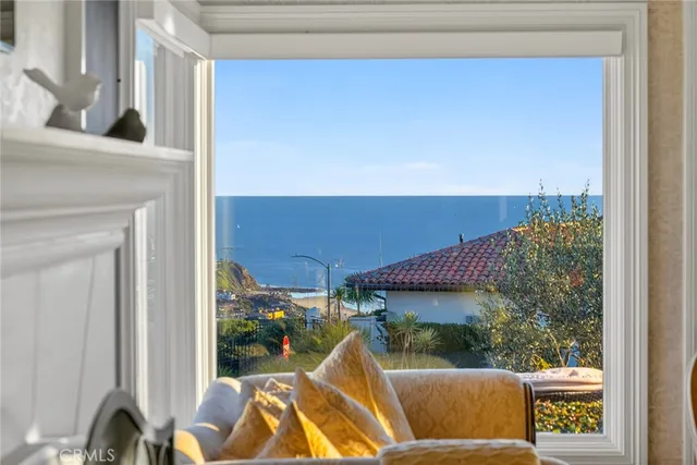 a large kitchen with stainless steel appliances lot of white cabinets